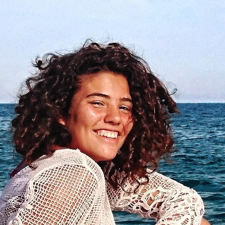 Alex Carter, Lead Design Curator at StreamFoldStudio, reviewing corporate floral arrangements